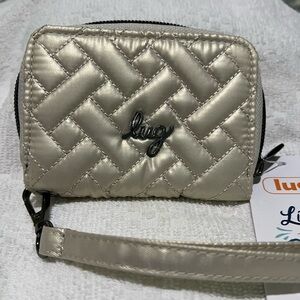 Lug Chipper Wristlet Wallet in Metallic Champagne.
